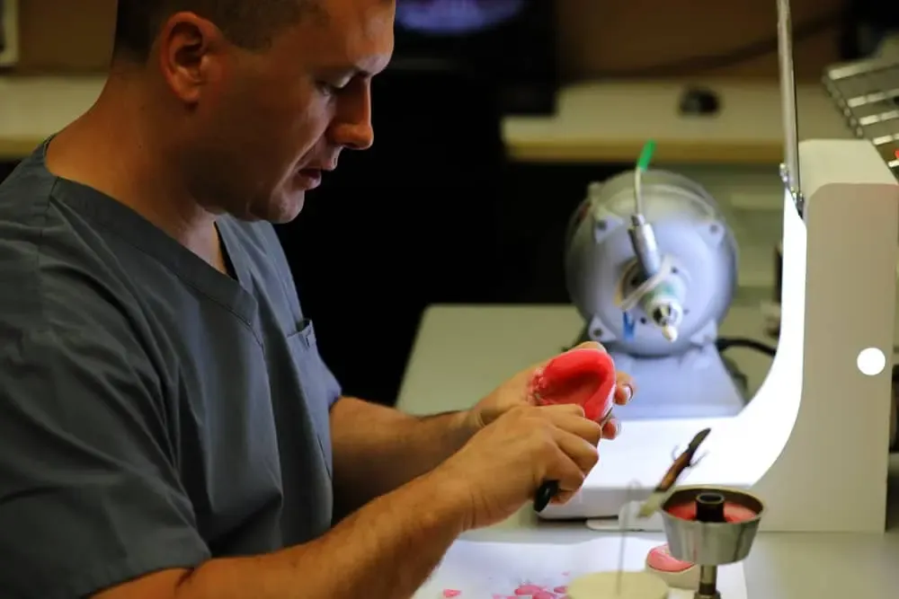 Dan Mihajlov working in the Hillhurst Denture Clinic laboratory