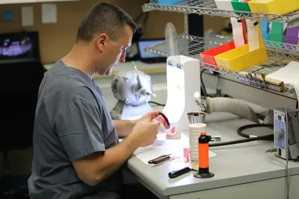 Immediate and surgical dentures being made